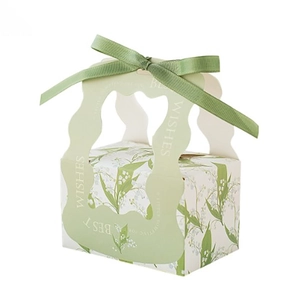Elegant green wedding favor box with lily of the valley floral pattern and green ribbon