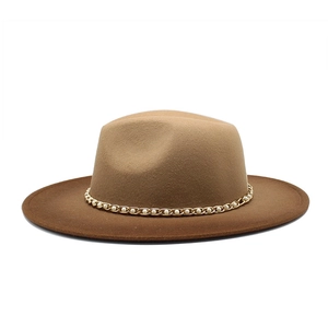 Detail of wool fedora hat featuring a gold chain band with white pearl accents