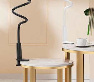 Detailed view of flexible black and white universal tablet mounts on marble table