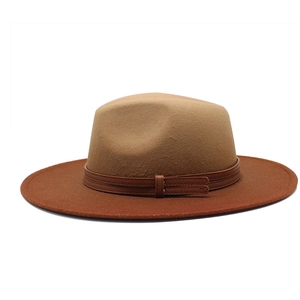 Detail of two-tone fedora hat with gradient felt texture and leather buckle band