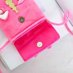 Pink plush unicorn crossbody bag for kids featuring a soft texture and magnetic clasp
