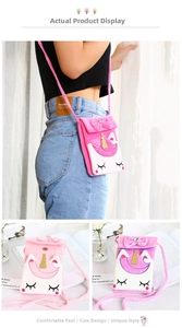 Close-up of pink plush unicorn crossbody bag with sequined horn and embroidery