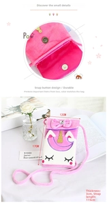 Detailed close-up of pink plush unicorn crossbody bag with magnetic buckle and floral decor