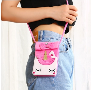 Pink unicorn plush shoulder bag with golden horn and cute embroidered eyes detail