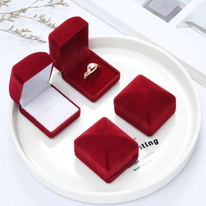 Premium red velvet jewelry gift box for rings and earrings in a stylish tray display