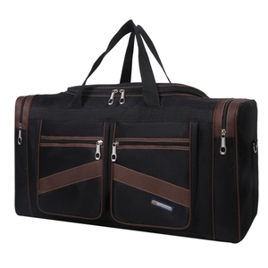 Close-up of black foldable travel bag featuring reinforced brown stitching and multi-pocket design