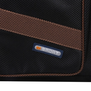 Close-up of black textured fabric with M SPORT logo and orange trim detail