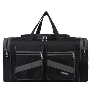 Macro view of black nylon travel bag featuring front zippered pockets and durable handles