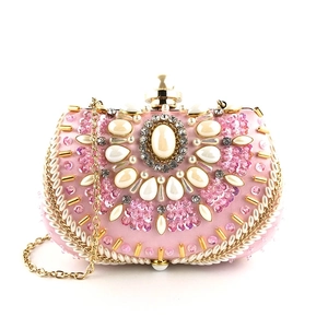 Pink pearl and rhinestone beaded clutch bag with gold chain strap for evening parties