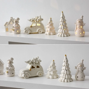 Ceramic Christmas ornaments with LED lights including snowmen and golden trees