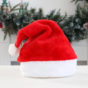 Classic red plush Christmas hat with white faux fur trim and pom-pom for holiday decor
