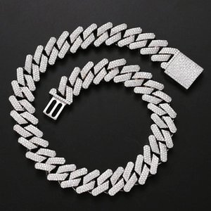 Close-up of a silver iced-out Cuban chain necklace with micro-pave white zircons