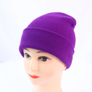 Detail of purple ribbed knit beanie showing high-stretch texture and warm folded cuff