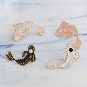 Set of four koi fish enamel pins in black white and pink with gold plated accents
