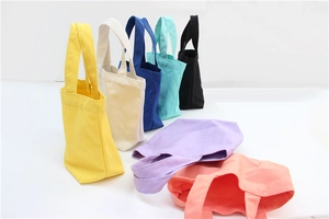 Detail view of colorful canvas lunch bags showing fabric texture and vibrant color options