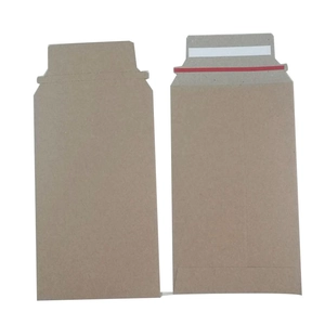 Detail view of brown kraft cardboard envelopes with red easy-tear strip for packaging