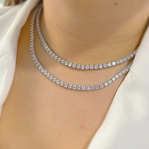 Double layered silver tennis necklace with round clear cubic zirconia on male model