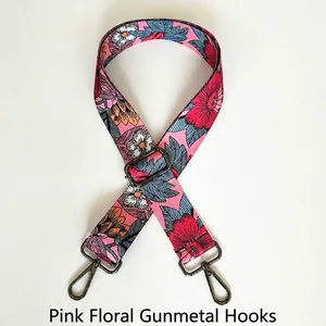 Detail of floral bag strap featuring pink flowers and gunmetal lobster clasps