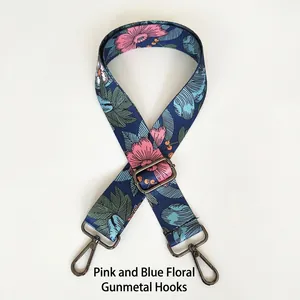 Detail of adjustable floral strap with pink blossoms and gunmetal hardware hooks