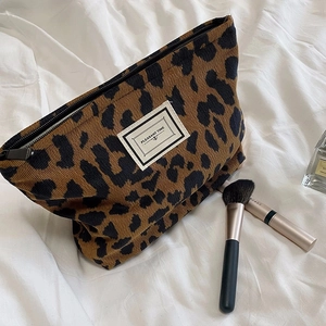 Vintage leopard print corduroy makeup bag with Pleasant Time label for travel storage