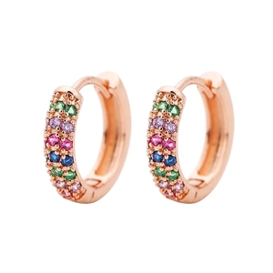 Macro shot of rose gold earrings with multi-colored cubic zirconia pave setting