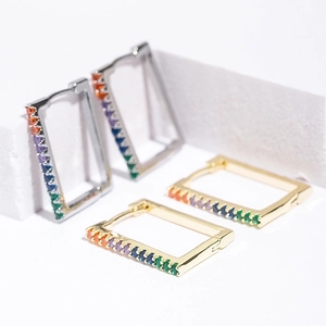 Rectangular gold and silver hoop earrings featuring colorful baguette-cut cubic zirconia