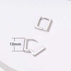 Macro detail of 10mm silver geometric square earrings with paved cubic zirconia stones