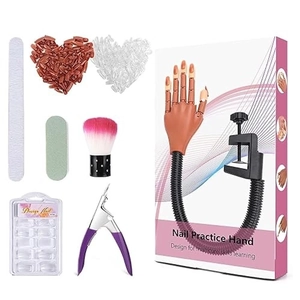 Professional nail practice hand set with false nails, files, and manicure tools on white background