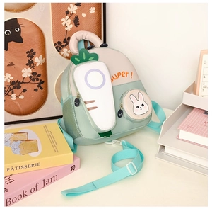 Detailed close-up of cartoon toddler backpack with carrot pockets and rabbit designs