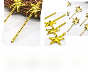 Macro details of gold electroplated plastic star magic wands for Christmas DIY decor