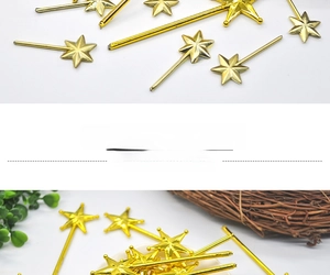 Detail of gold electroplated plastic star wands in long and short lengths for party decor