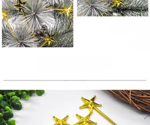 Close-up of golden pentagram picks and frosted pine needle branches for Christmas DIY decor