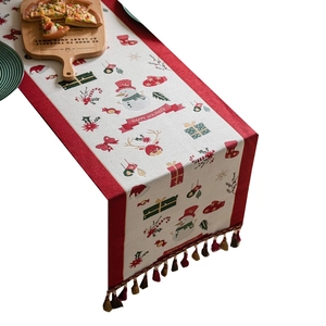 Christmas table runner with snowman reindeer jacquard pattern and colorful tassels