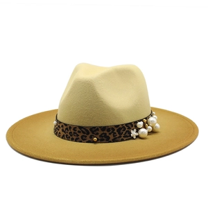 Elegant wide brim felt fedora hat with leopard print band and pearl accents on white base