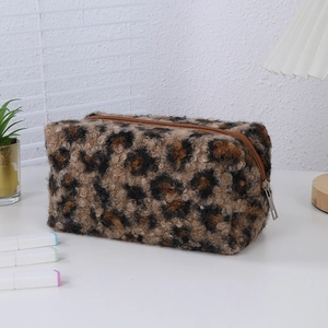 Detailed view of plush leopard print makeup bag with a high-quality metal zipper closure