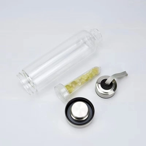 Portable glass water bottle with yellow crystal stone infuser and stainless steel lid