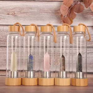 Bamboo lid glass bottles featuring five colorful natural hexagonal crystal pillars inside