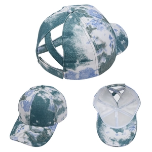 Detail view of tie-dye baseball cap with criss-cross elastic ponytail hole back