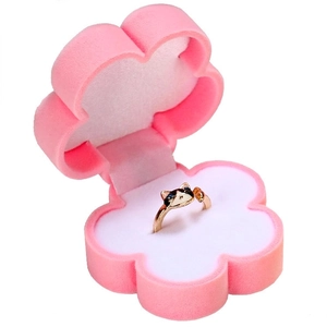 Cat shaped ring with blue crystal eyes inside a pink flower velvet jewelry box