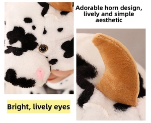 Detail of plush cow hat with moving ears, soft texture and cute horn design details