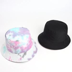 Pair of bucket hats featuring a colorful tie-dye pattern and a classic solid black finish.