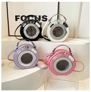 Various colors of unique washing machine shaped mini round bags on display stand