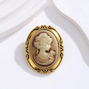 Retro European style gold metal oval brooch with elegant female silhouette cameo