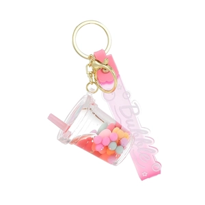 Pink bubble tea acrylic quicksand keychain with colorful beads and matching wrist strap