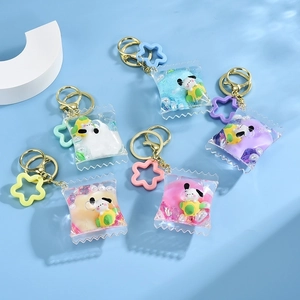 Cute puppy liquid oil bottle keychains in various colors with pearls and floral charms