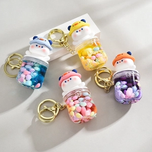 Creative liquid sand bear keychains with golden metal rings in four vibrant colors