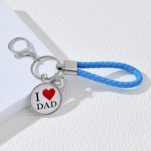 Detailed shot of a blue braided keychain with 'I ❤️ DAD' alloy pendant and spring clasp