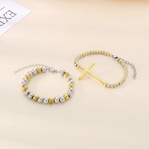 Two-tone silver and gold beaded stainless steel bracelet with a cross pendant charm