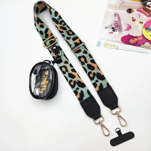 Crossbody phone strap in leopard print with round coin purse and connector patch