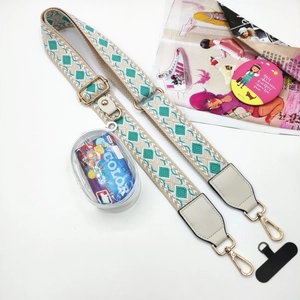 Adjustable ethnic embroidery crossbody strap with gold metal hooks and round zip pouch